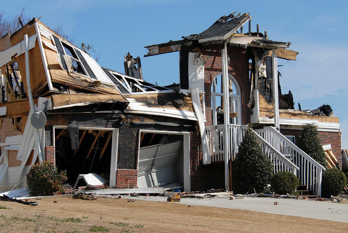 A house severely damaged by fire is shown to explain the importance of home owners insurance